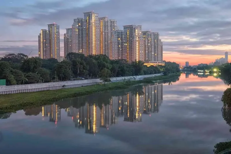 Abhee City Urban Glenn towers overlooking the man-made lake at sunset